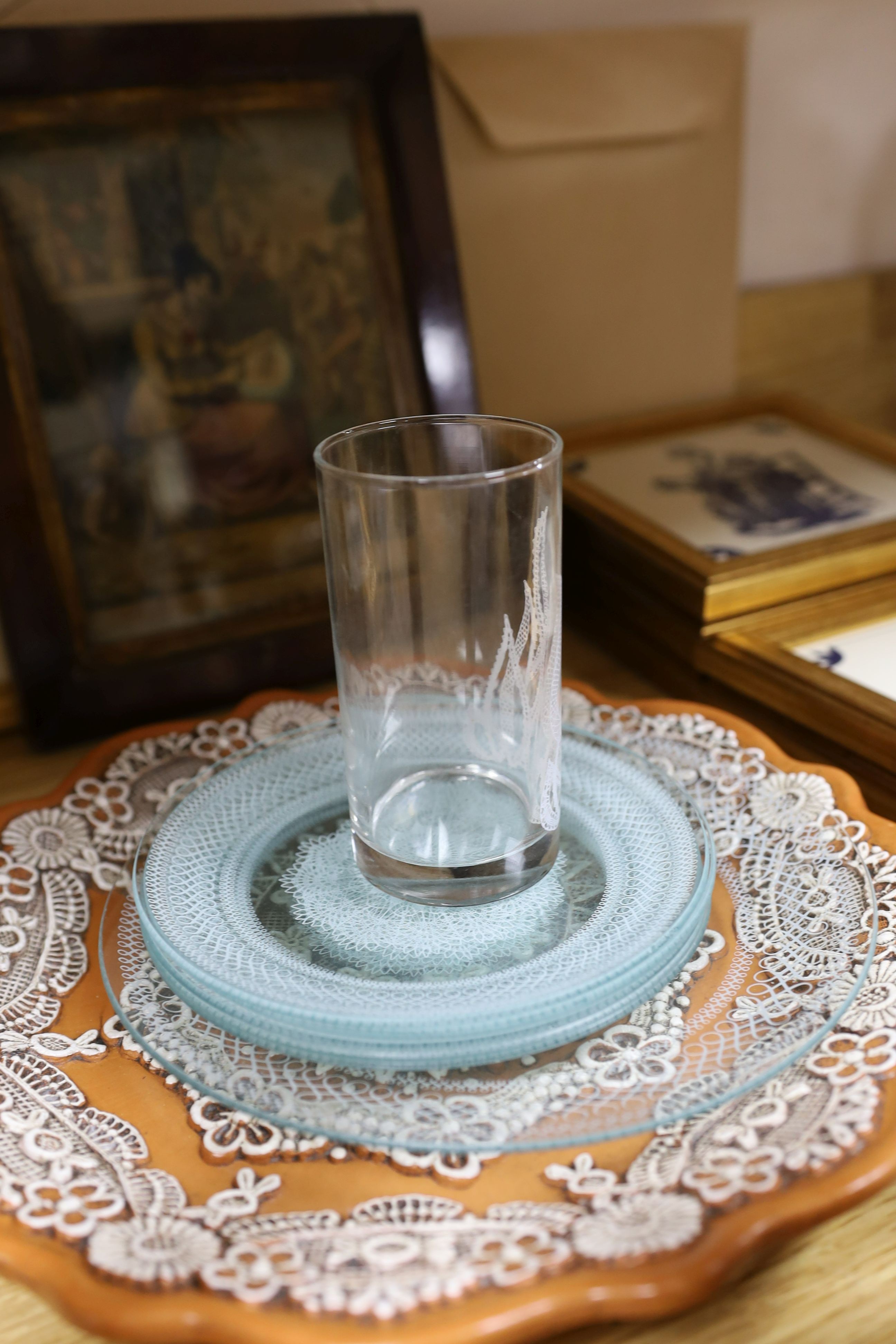 A cold cast bronze, Bobbin lace maker, similar carved wood figure, ceramic lace-pattern dish etc
